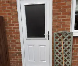 GRP composite door in White with Sandstone glass fitted in Derby
