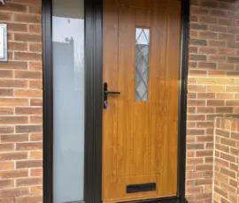 Composite door in Light Oak with Black external frame and Satin Glass fitted in Oakwood, Derbyshire