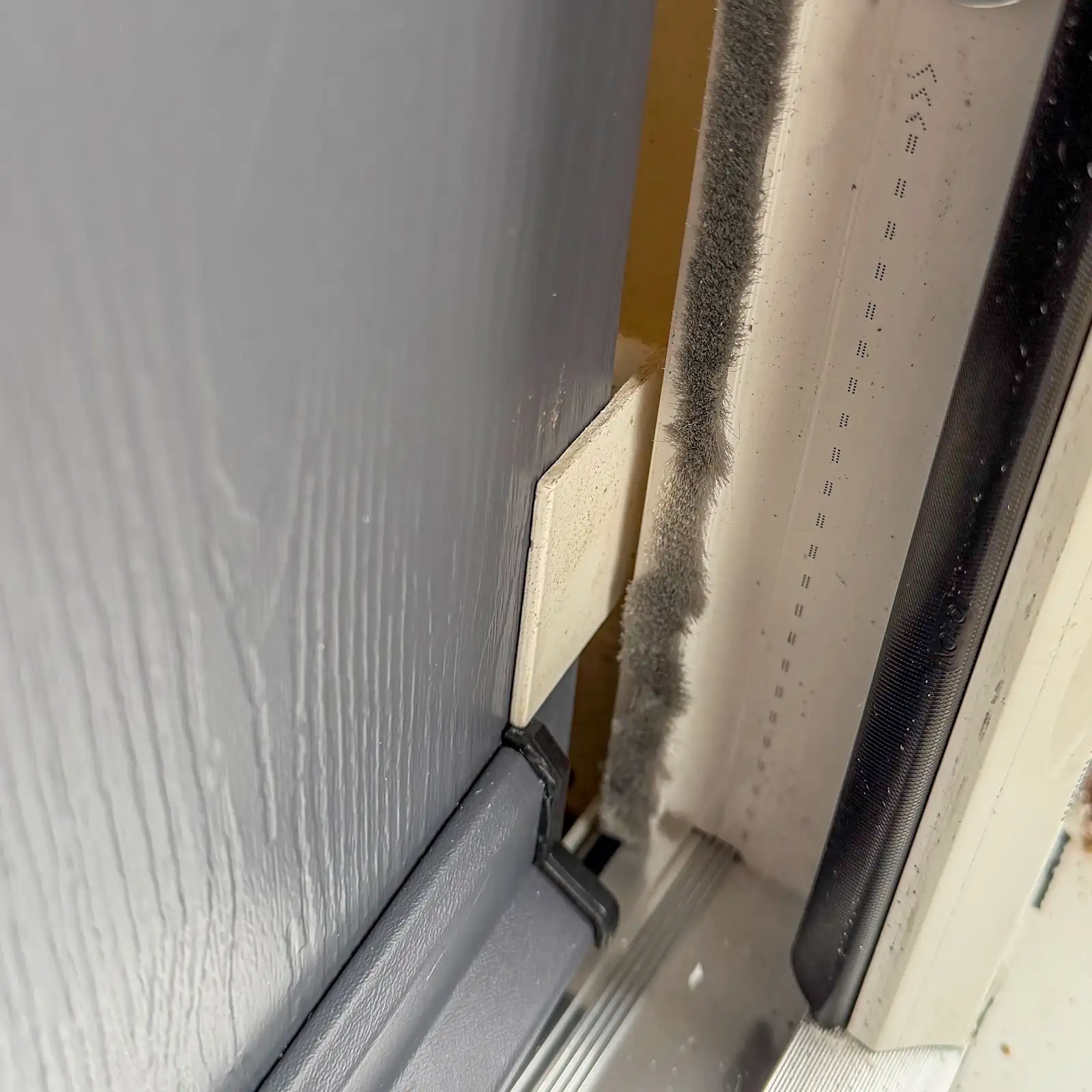 Checking the twist at the bottom of the Rockdoor during installation by very secure doors