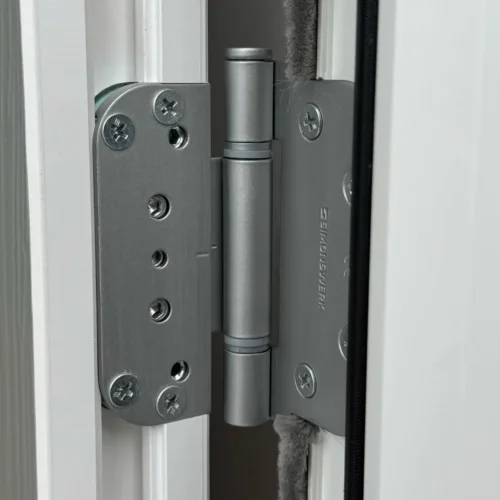 Close up of a Rockdoor 3D hinge in Satin Silver