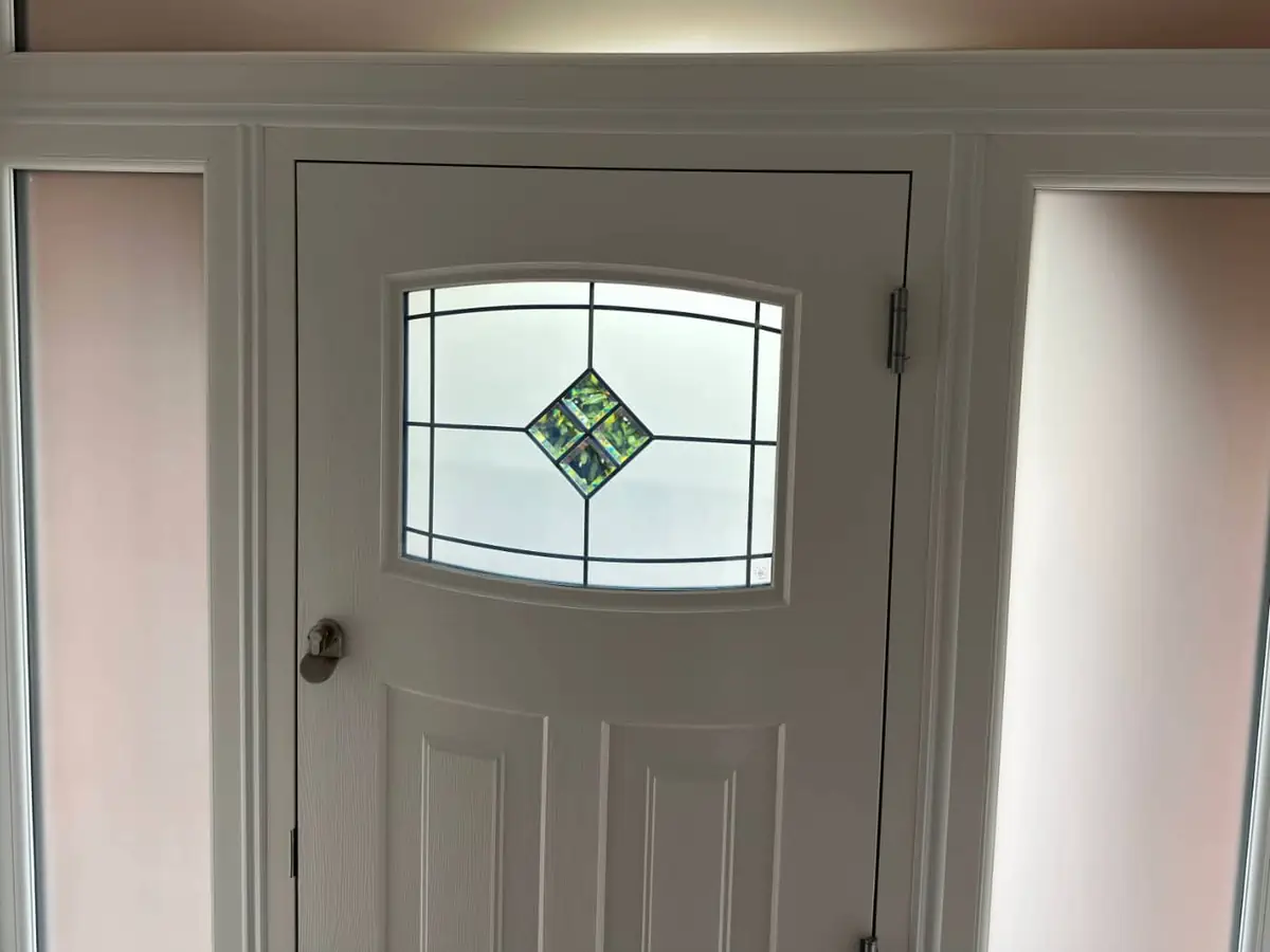 Photo of the internal side of a rockdoor, showing brush pile around the edge of the door