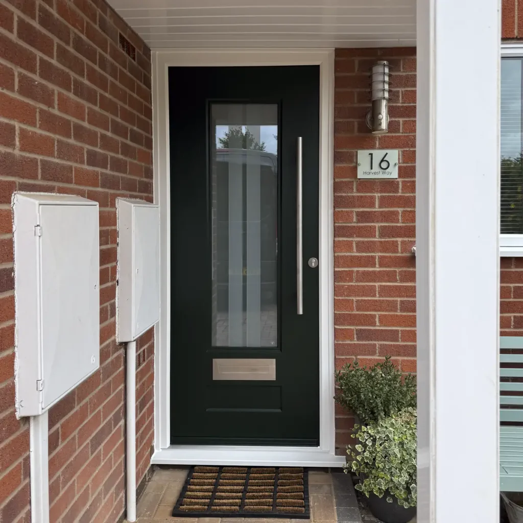 Rockdoor Vogue with Archer glass in Emerald Green and 1200mm round bar handle fitted in Groby, Leicestershire